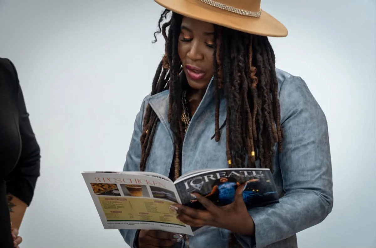 Guest reads an issue of I Create Magazine